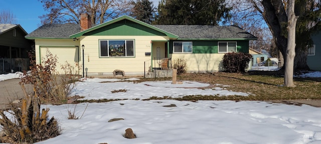 single story home featuring a chimney, crawl space, and an attached garage