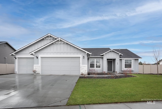 view of front of house with a garage and a front yard