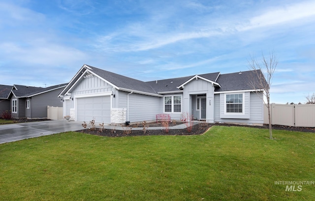 single story home featuring a garage and a front yard