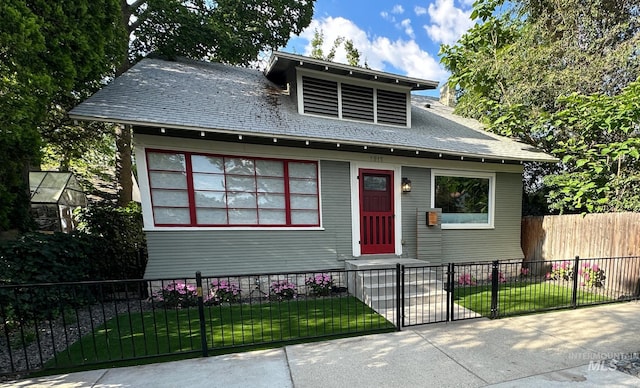 view of front of house featuring a fenced front yard, entry steps, and a front yard