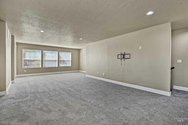 5278 N Cougar Flat Pl, Meridian, ID 83646 - carpeted spare room with baseboards, recessed lighting, and a textured ceiling