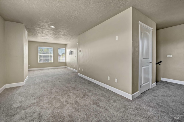 5278 N Cougar Flat Pl, Meridian, ID 83646 - unfurnished room with baseboards, carpet flooring, and a textured ceiling