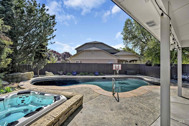 5278 N Cougar Flat Pl, Meridian, ID 83646 - view of pool with a jacuzzi, a fenced in pool, a fenced backyard, and a patio