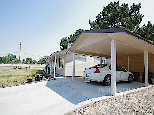 exterior space featuring a carport