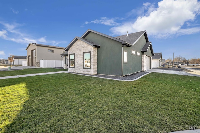 view of property exterior with a garage and a lawn