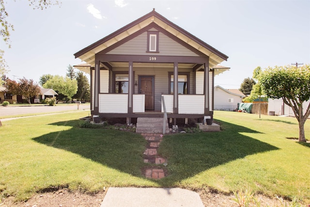 599 S Ada St, Glenns Ferry, ID 83623 - bungalow-style house featuring a front lawn and covered porch