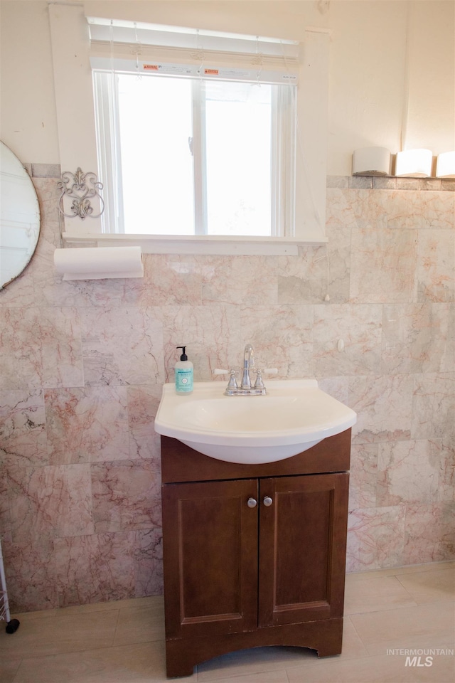 599 S Ada St, Glenns Ferry, ID 83623 - half bathroom featuring vanity and tile walls