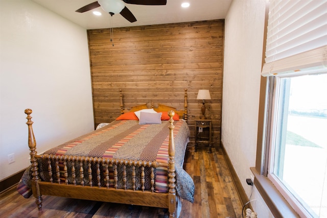 599 S Ada St, Glenns Ferry, ID 83623 - bedroom featuring wood walls, multiple windows, wood finished floors, recessed lighting, and a ceiling fan