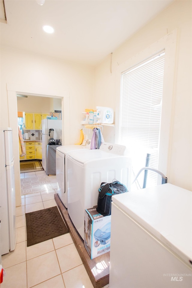 599 S Ada St, Glenns Ferry, ID 83623 - washroom with washing machine and dryer, light tile patterned floors, and recessed lighting