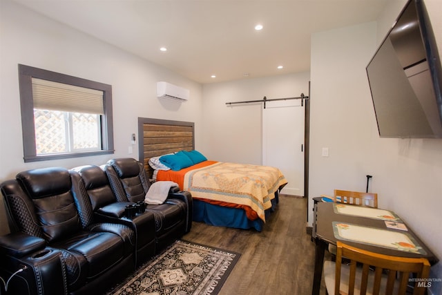 599 S Ada St, Glenns Ferry, ID 83623 - bedroom with a barn door, a wall unit AC, wood finished floors, and recessed lighting