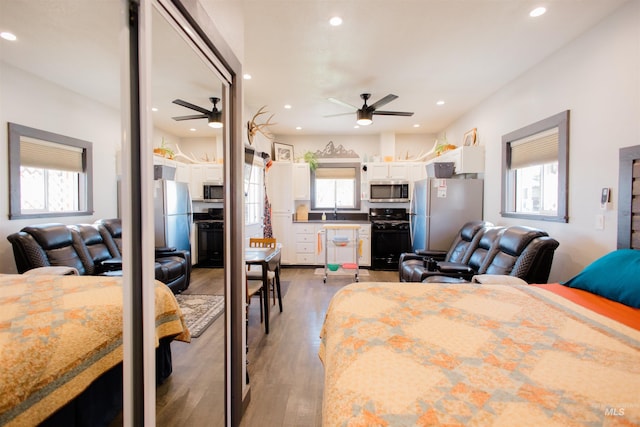 599 S Ada St, Glenns Ferry, ID 83623 - bedroom featuring freestanding refrigerator, wood finished floors, and recessed lighting