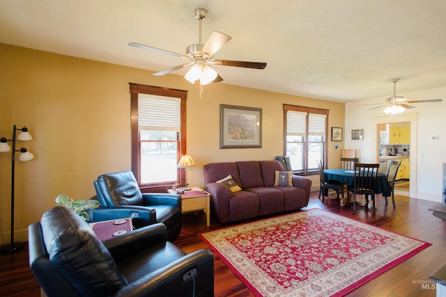 599 S Ada St, Glenns Ferry, ID 83623 - living room featuring a ceiling fan and dark wood-style flooring