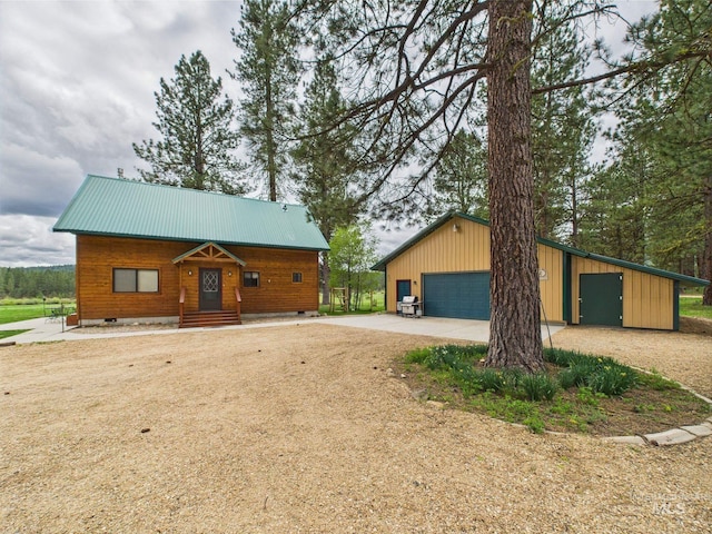 19 Hack Ln, Idaho City, ID 83631 - view of front of property with a detached garage, crawl space, an outdoor structure, and metal roof