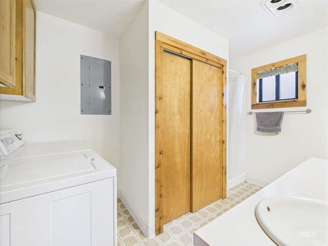 19 Hack Ln, Idaho City, ID 83631 - full bathroom with electric panel, washing machine and clothes dryer, vanity, tile patterned floors, and a shower with shower curtain