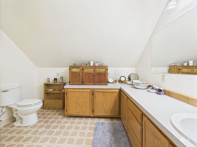 19 Hack Ln, Idaho City, ID 83631 - bathroom with lofted ceiling, toilet, and vanity