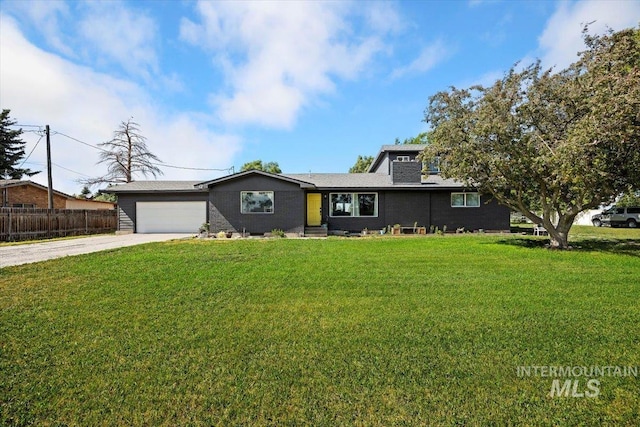 single story home featuring a front lawn and a garage