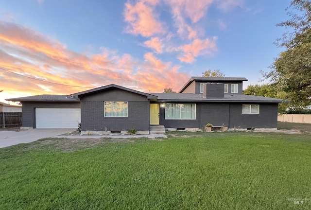 590 W 300 S, Heyburn, ID 83336 - view of front facade featuring driveway, an attached garage, and brick siding