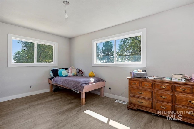 bedroom featuring light wood-type flooring