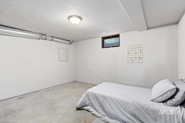 bedroom with a textured ceiling