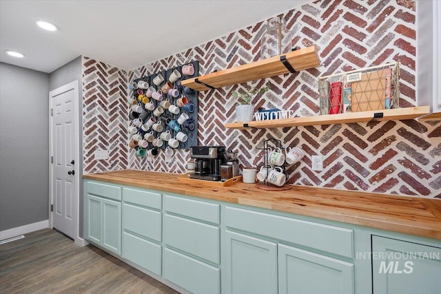 kitchen featuring hardwood / wood-style flooring and wood counters