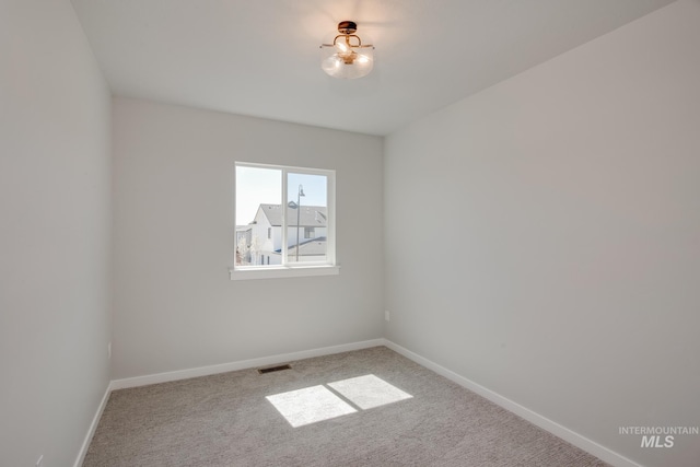 view of carpeted spare room