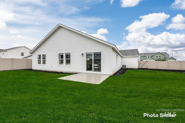 back of property with a lawn, a fenced backyard, a patio, and central AC