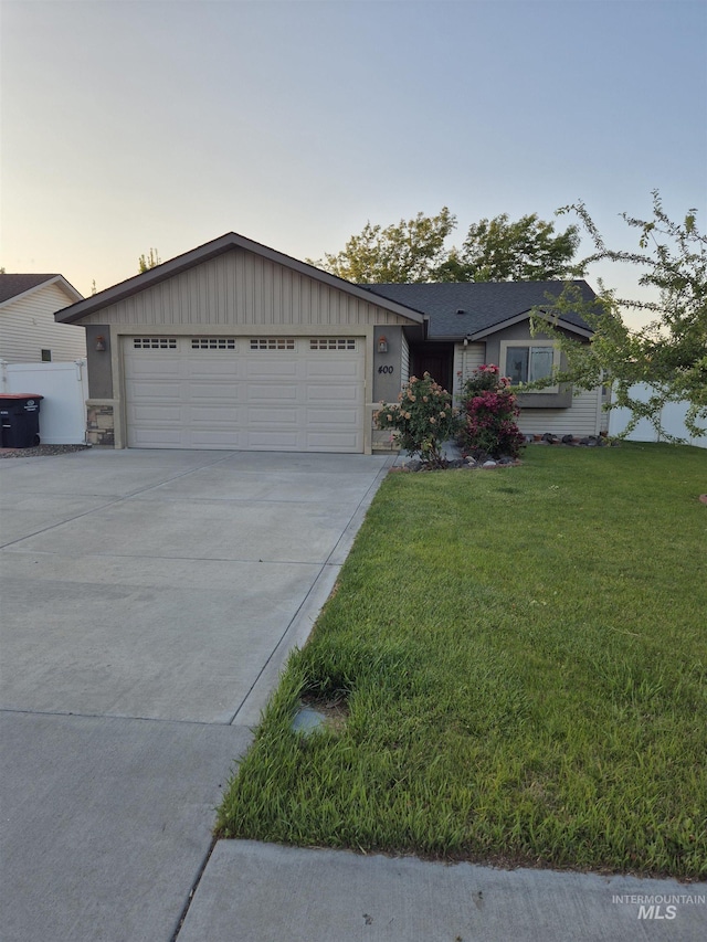 400 Pheasant Rd W, Twin Falls, ID 83301 - ranch-style home with a yard, concrete driveway, and an attached garage