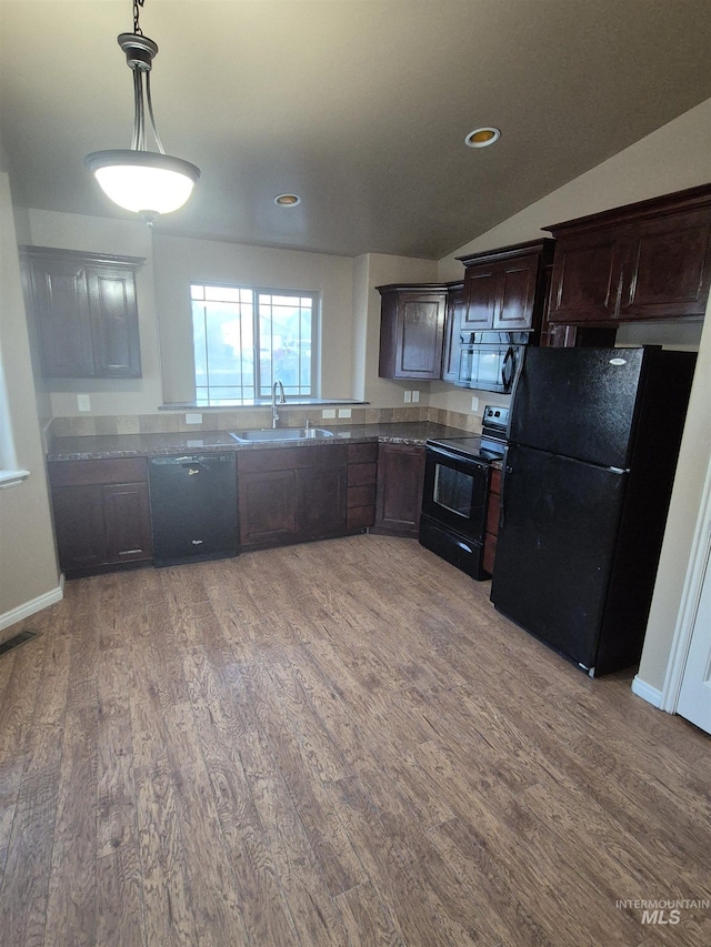 400 Pheasant Rd W, Twin Falls, ID 83301 - kitchen featuring black appliances, light wood-type flooring, dark brown cabinets, pendant lighting, and vaulted ceiling