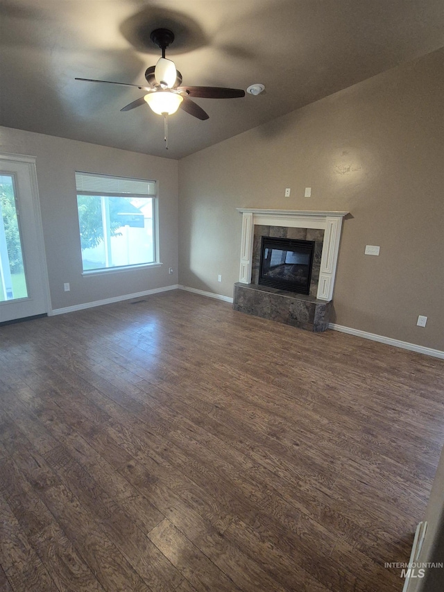 400 Pheasant Rd W, Twin Falls, ID 83301 - unfurnished living room featuring dark wood finished floors, plenty of natural light, a premium fireplace, a ceiling fan, and vaulted ceiling