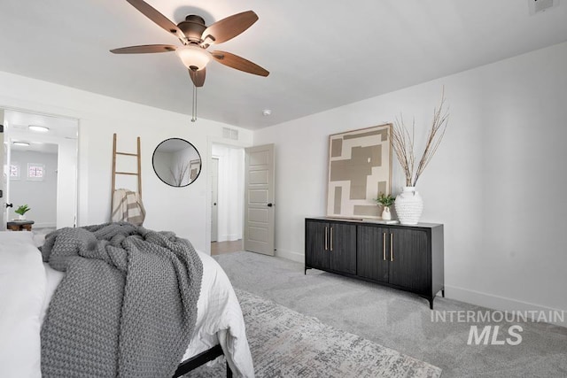 bedroom featuring light colored carpet, baseboards, and ceiling fan