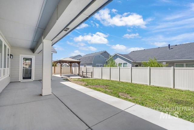 view of patio featuring a gazebo and a residential view