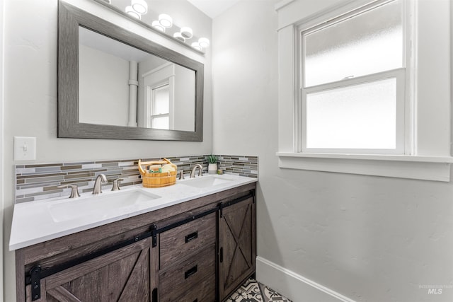 bathroom with decorative backsplash and vanity