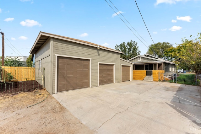 view of front of house featuring a garage and an outdoor structure