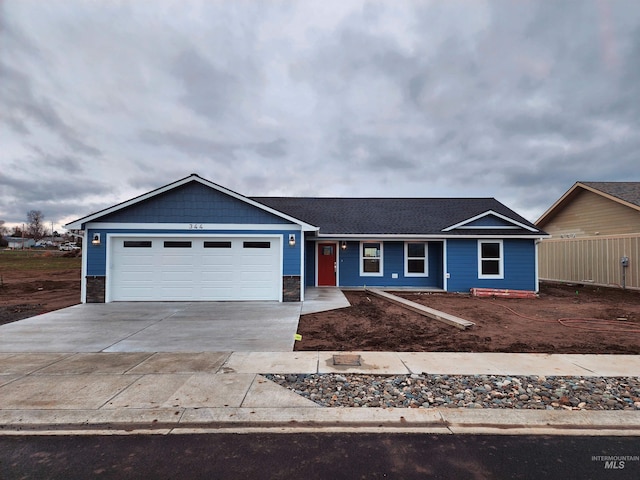 ranch-style house featuring a garage