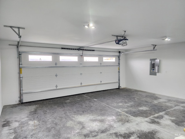 garage featuring a garage door opener and electric panel