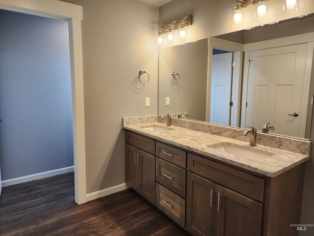 bathroom featuring vanity and hardwood / wood-style flooring