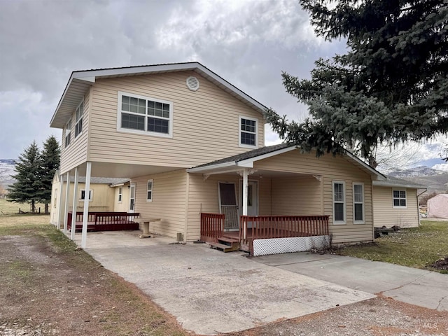 263 Whitman St, Albion, ID 83311 - view of front of house with concrete driveway, a porch, and a carport
