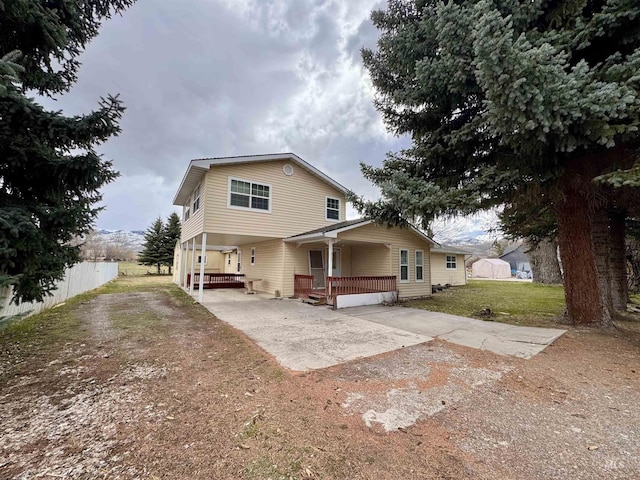 263 Whitman St, Albion, ID 83311 - back of property featuring fence, a lawn, a carport, and dirt driveway