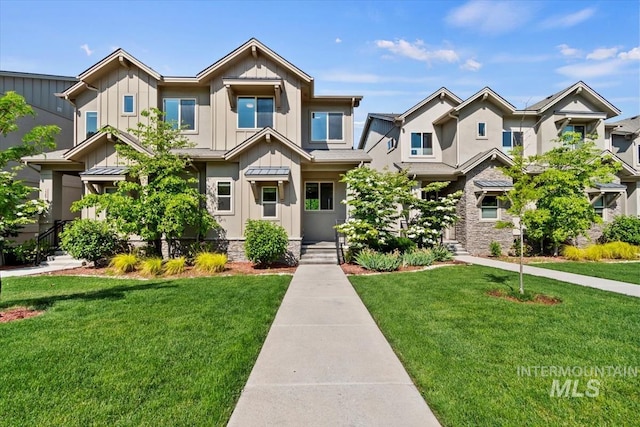 2381 E Warm Spgs, Boise, ID 83712 - view of front of house featuring board and batten siding and a front yard