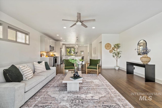 2381 E Warm Spgs, Boise, ID 83712 - living area featuring recessed lighting, ceiling fan, dark wood-style flooring, a chandelier, and baseboards