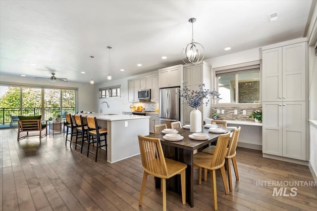 2381 E Warm Spgs, Boise, ID 83712 - dining room featuring recessed lighting, dark wood-style floors, ceiling fan, and a chandelier