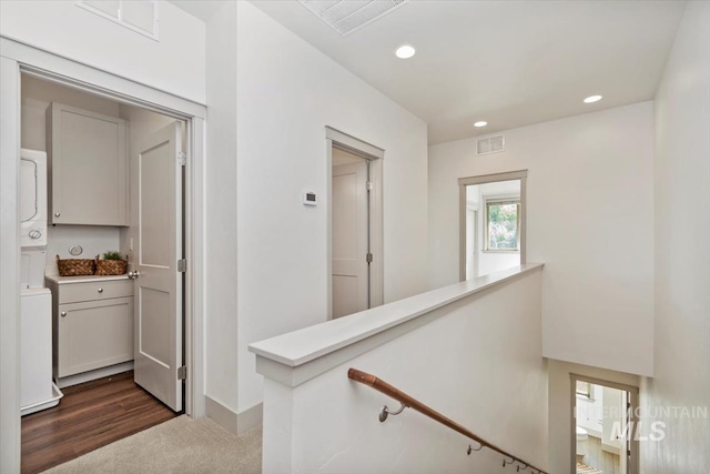 2381 E Warm Spgs, Boise, ID 83712 - hallway featuring stacked washing machine and dryer, an upstairs landing, recessed lighting, baseboards, and dark carpet