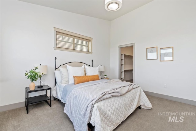2381 E Warm Spgs, Boise, ID 83712 - bedroom featuring light colored carpet and a walk in closet