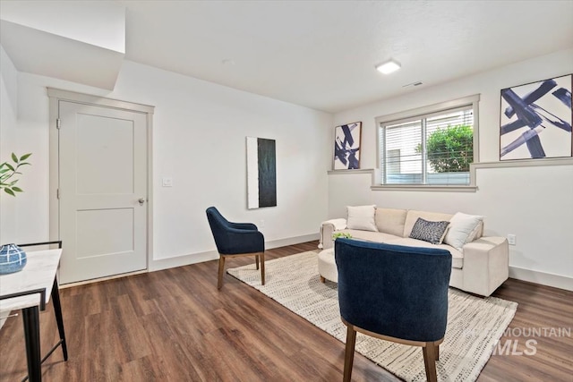 2381 E Warm Spgs, Boise, ID 83712 - living room featuring dark wood-style flooring and baseboards