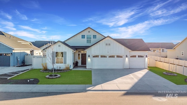 view of front of house with a garage and a front lawn