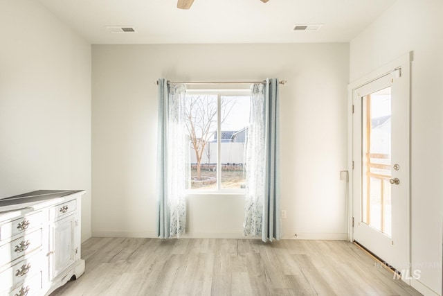 interior space with ceiling fan and light hardwood / wood-style flooring