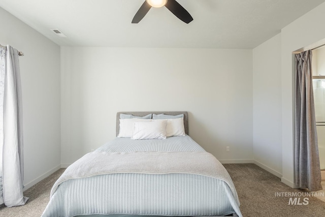 carpeted bedroom featuring ceiling fan