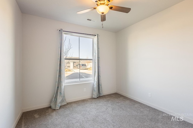 carpeted empty room with ceiling fan