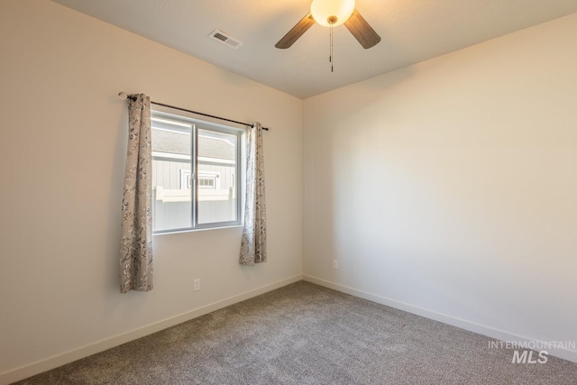 empty room featuring carpet flooring and ceiling fan