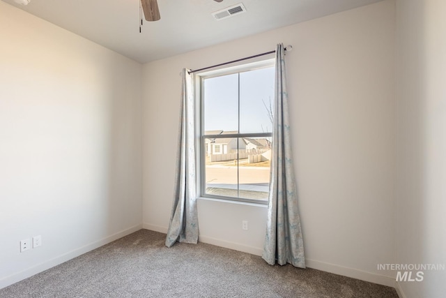 unfurnished room featuring carpet floors and ceiling fan